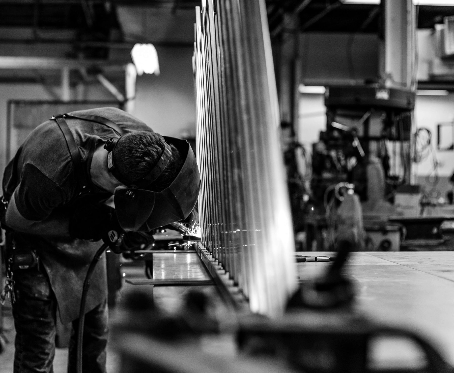 A welder at work in a fabrication shop